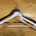 white wooden hangers
