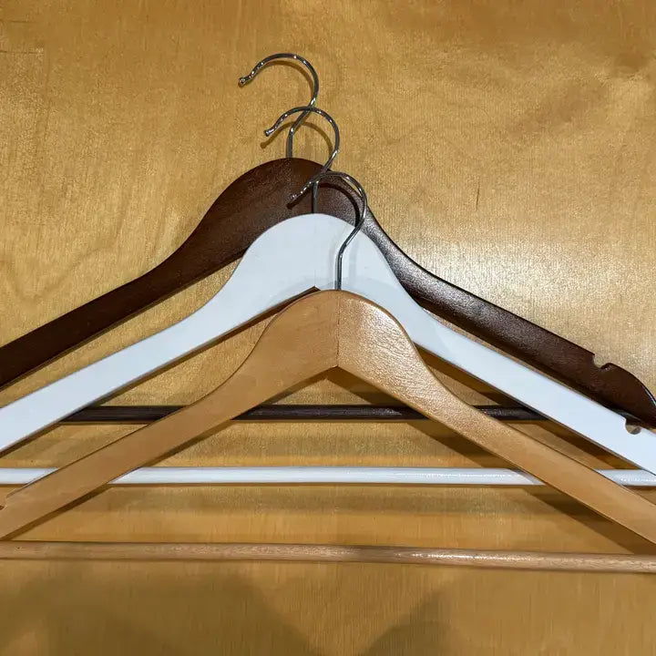 white wooden hangers